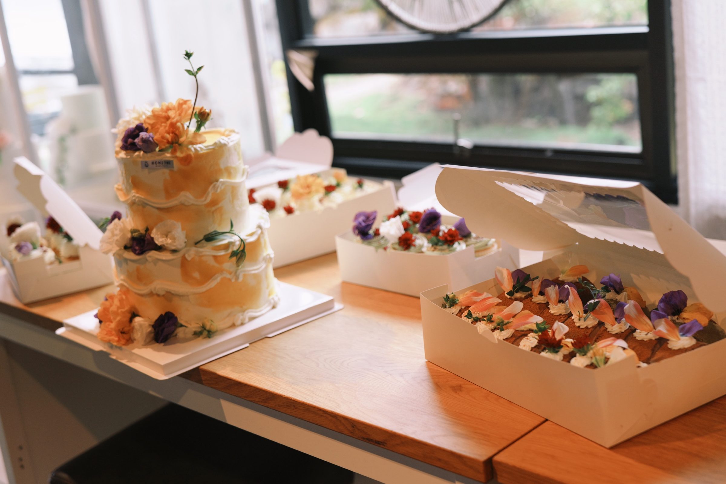 A tiered HoneyMe celebration cake