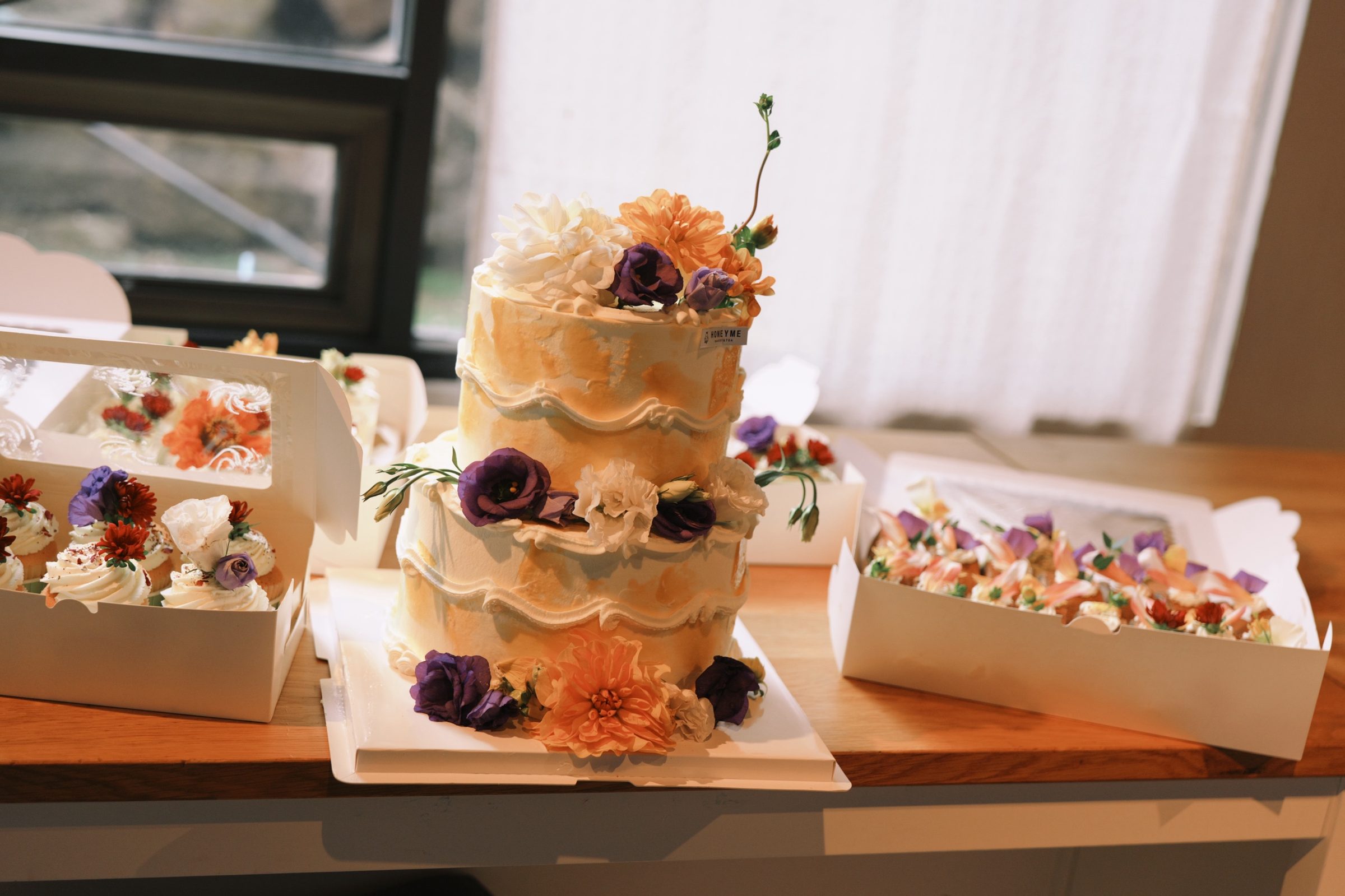 Two-tier floral wedding cake, second angle